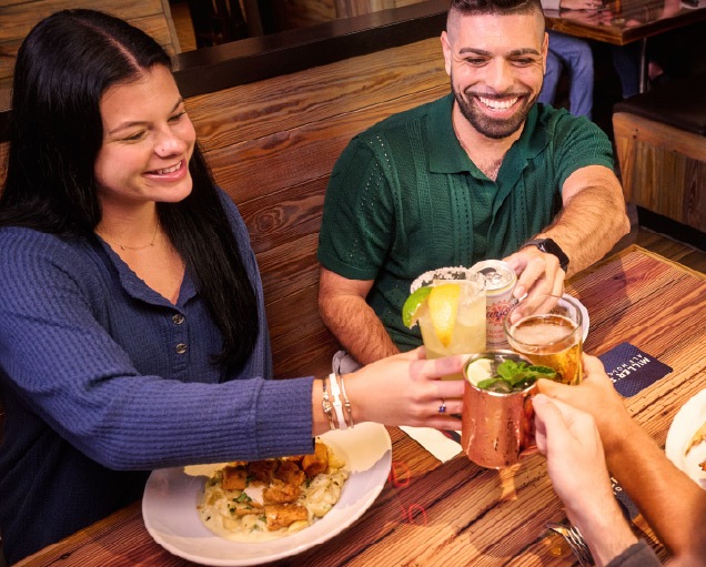 Two customers at millers cheersing